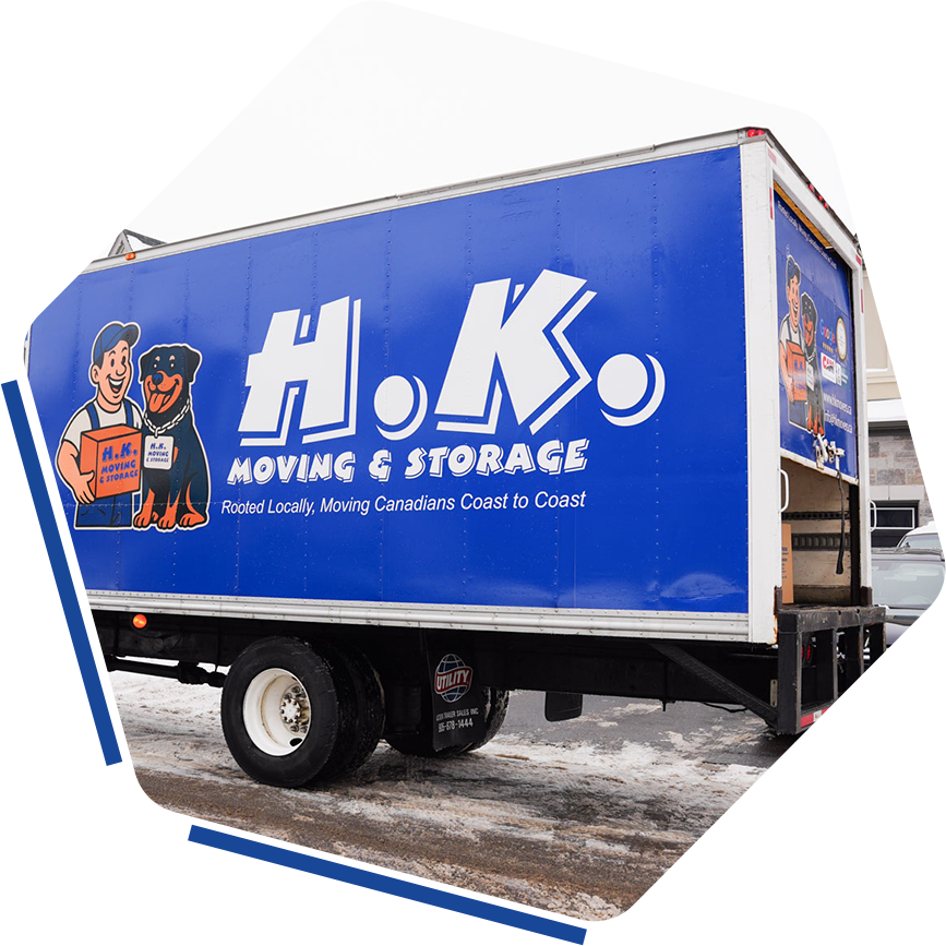 H.K. Moving and Storage truck parked outside home