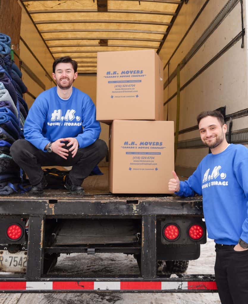 Movers loading boxes into a moving truck